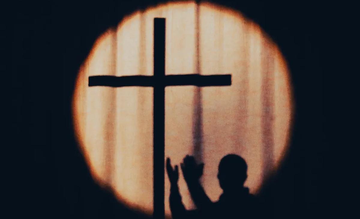 Silhouette of a cross at sunset
