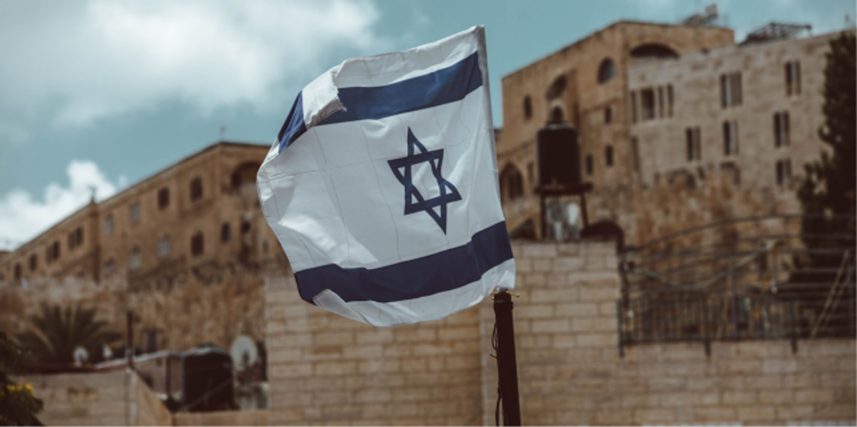 Israeli flag against the sky