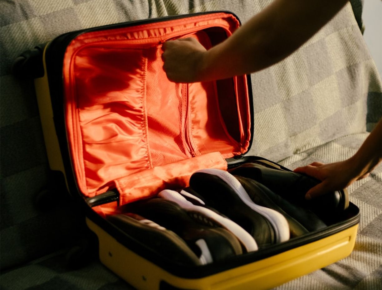 An open suitcase packed for a trip