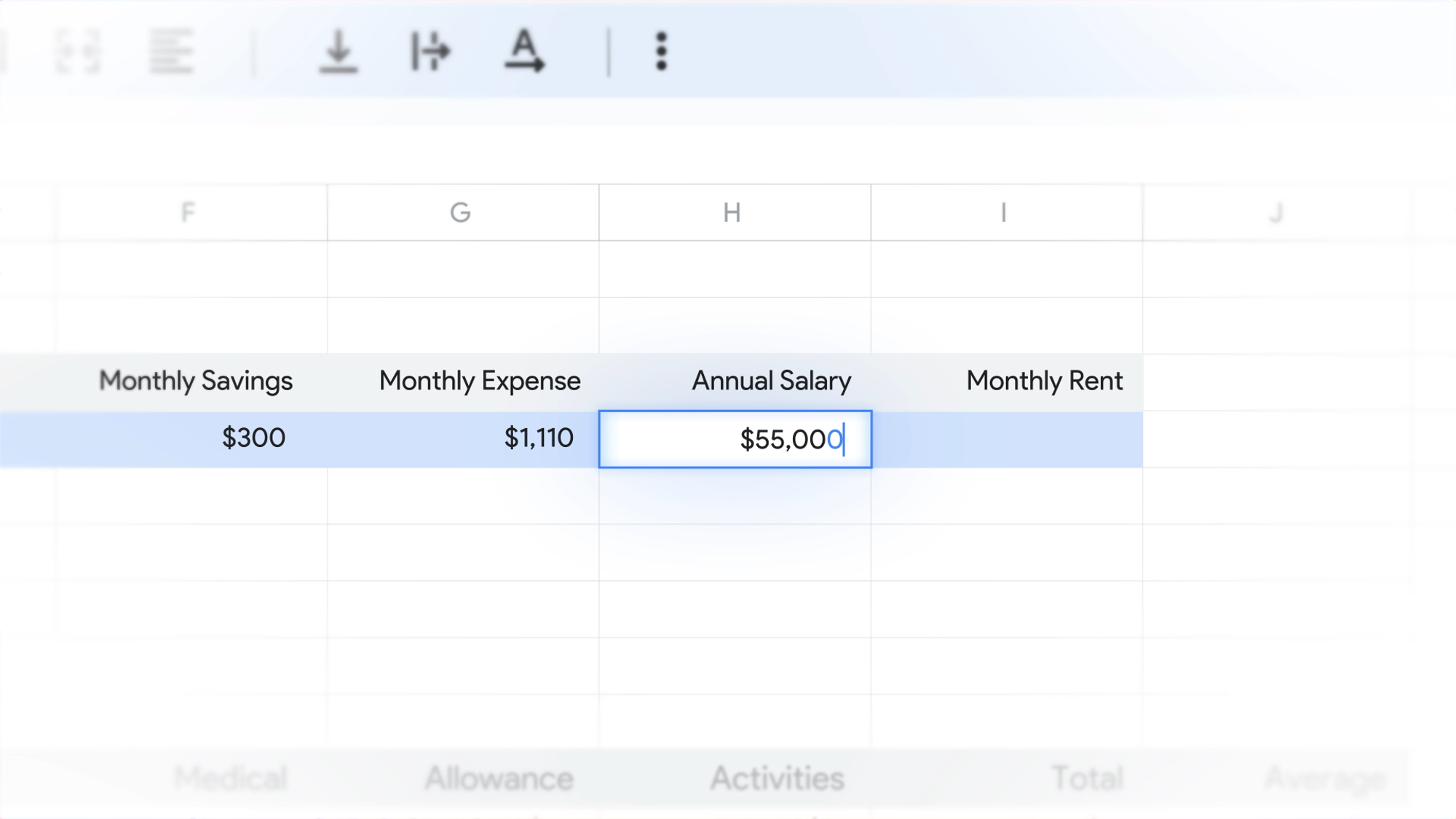 Typing annual salary into a financial spreadsheet.