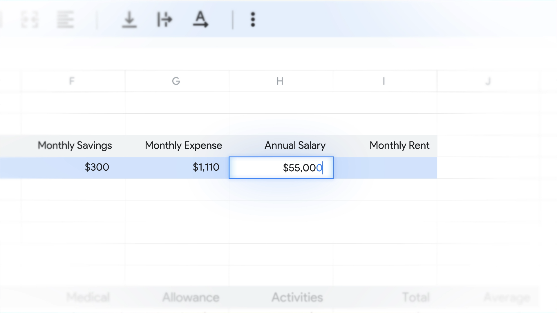 Typing annual salary into a financial spreadsheet.