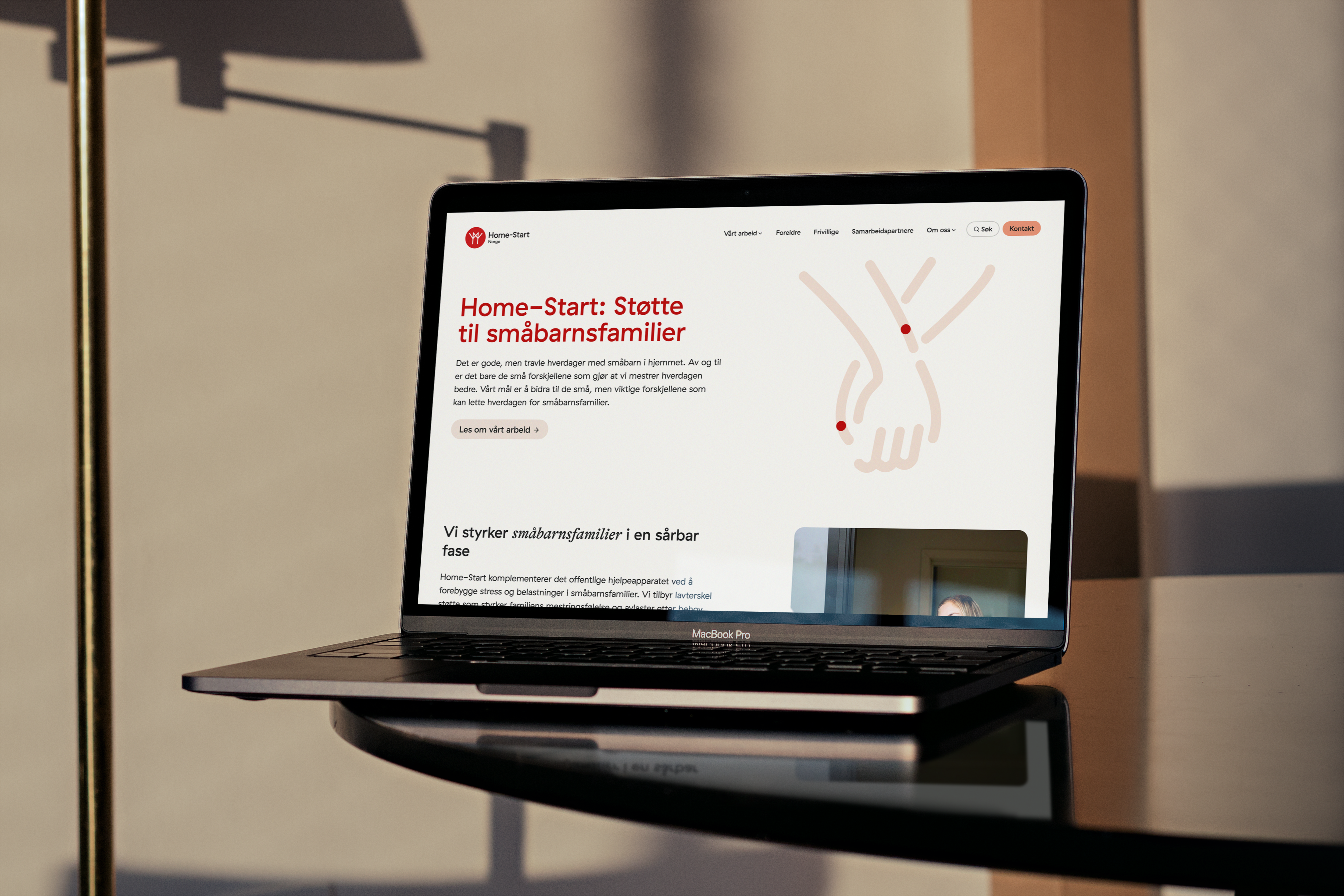 a laptop is open to a page that says home-start