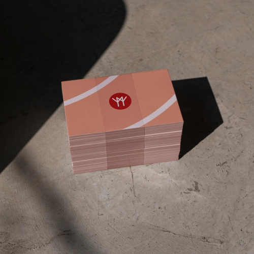 a stack of business cards with the letter y on it