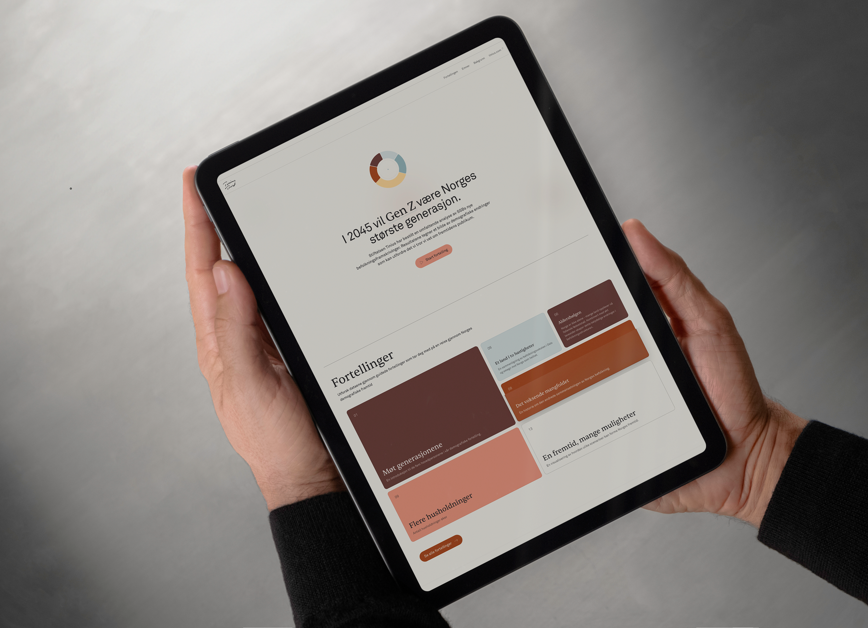 a person is holding a tablet with a website on it