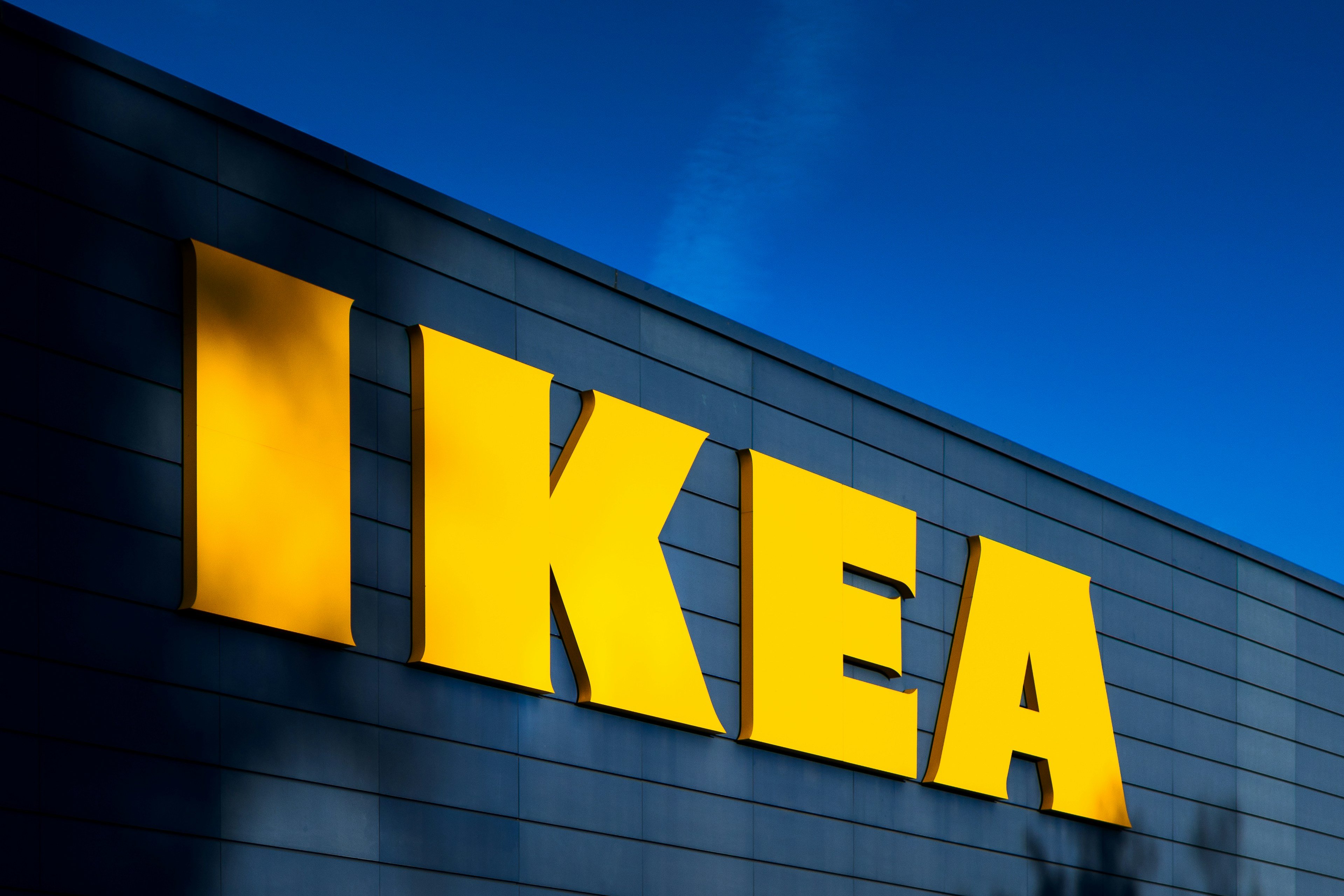 the ikea logo is on the side of a building .
