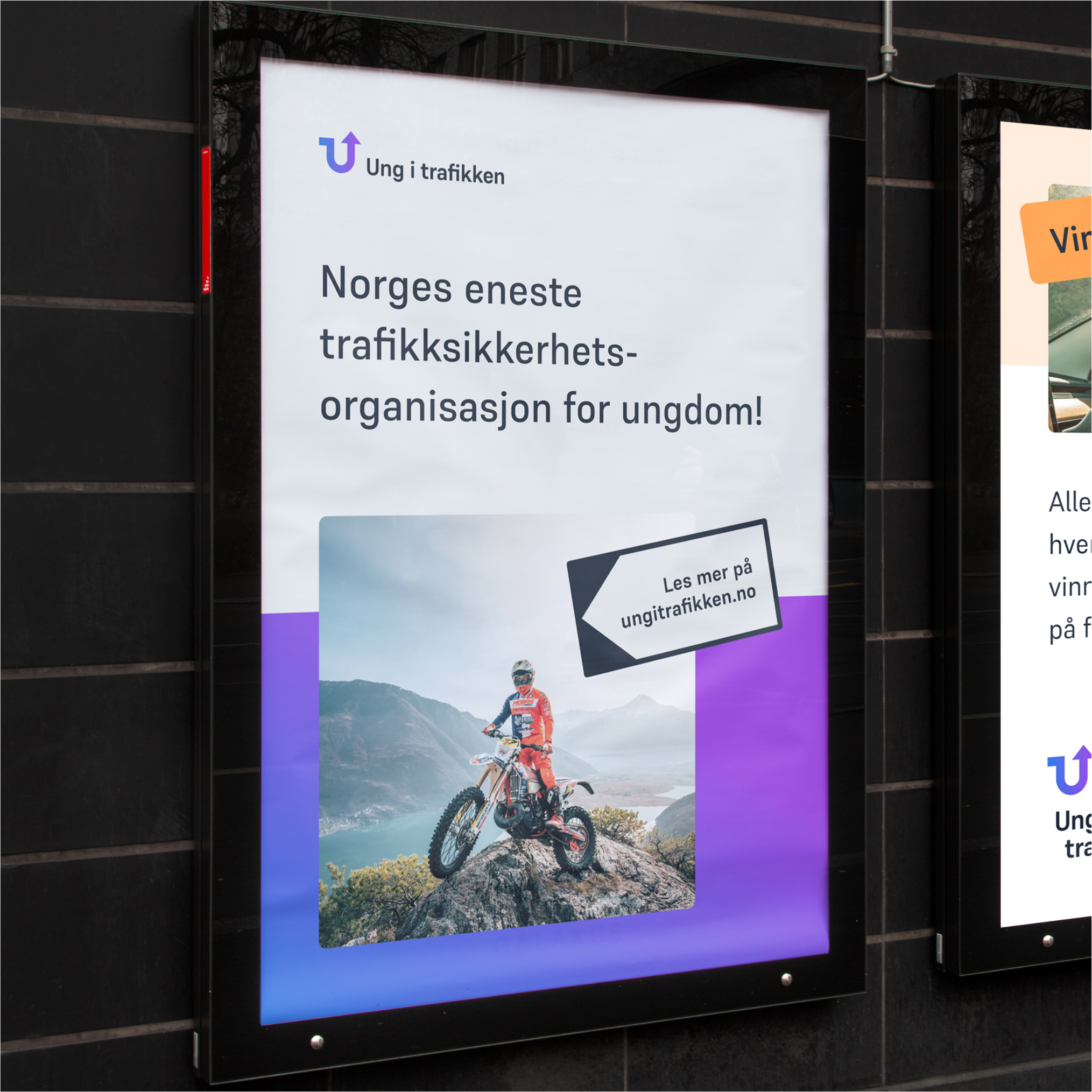 a billboard for ung i trafikken shows a man riding a dirt bike on top of a mountain