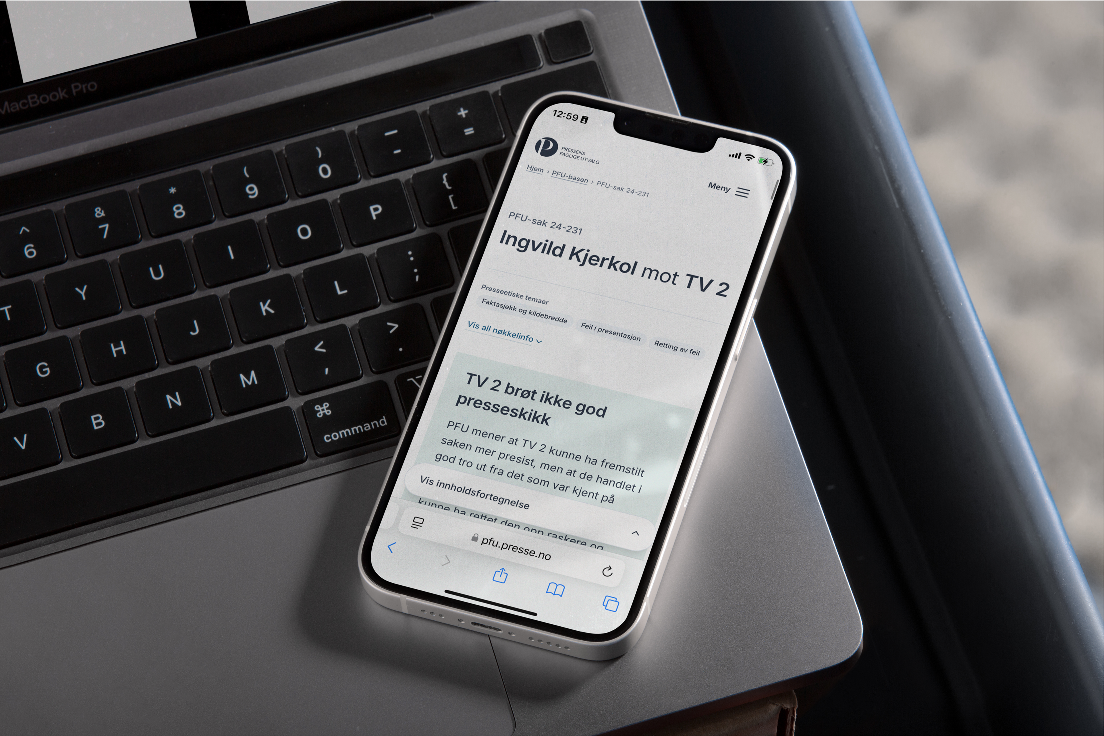 a phone displays a news article about tv 2