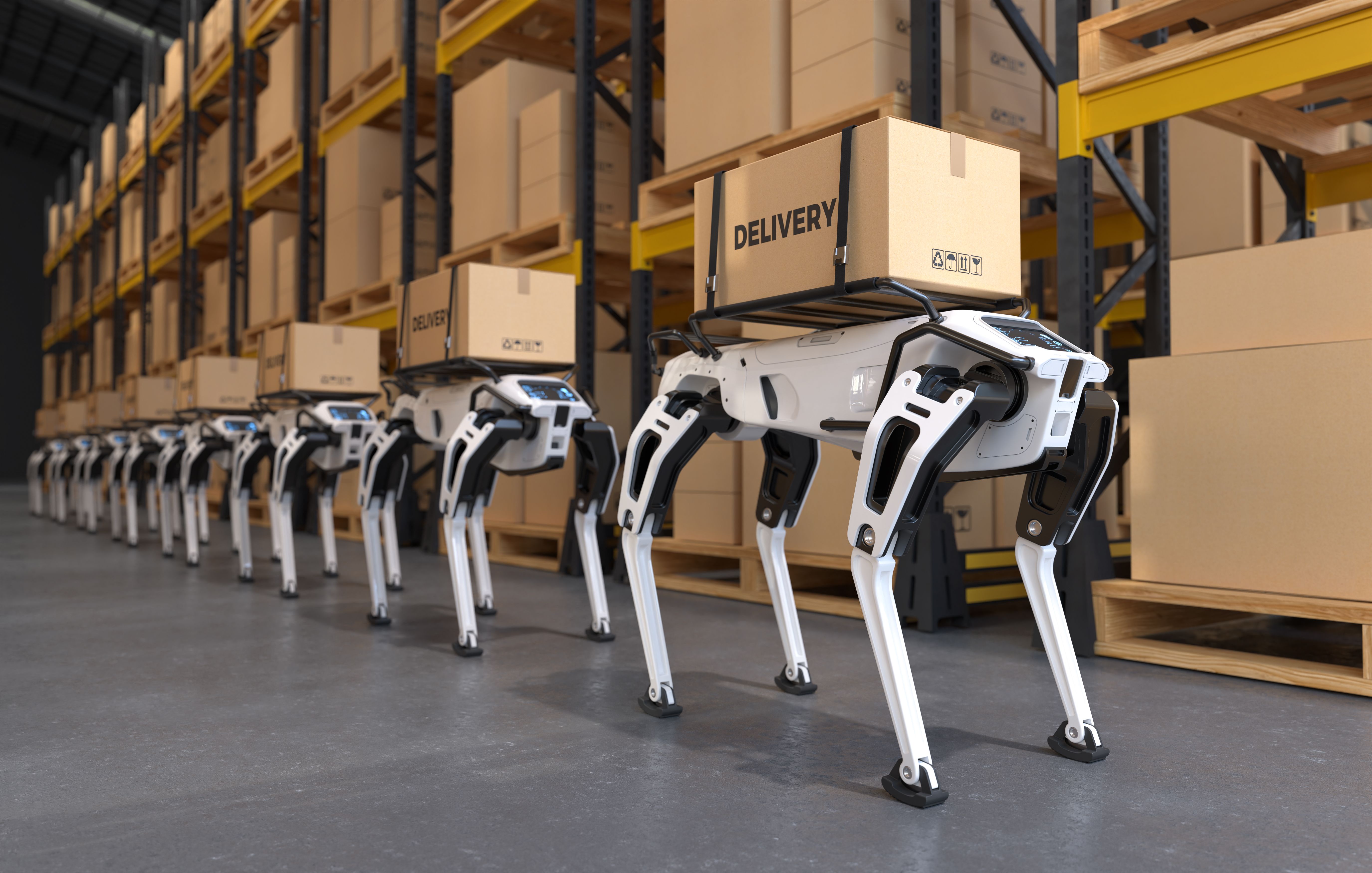 a row of robotic arms in a warehouse