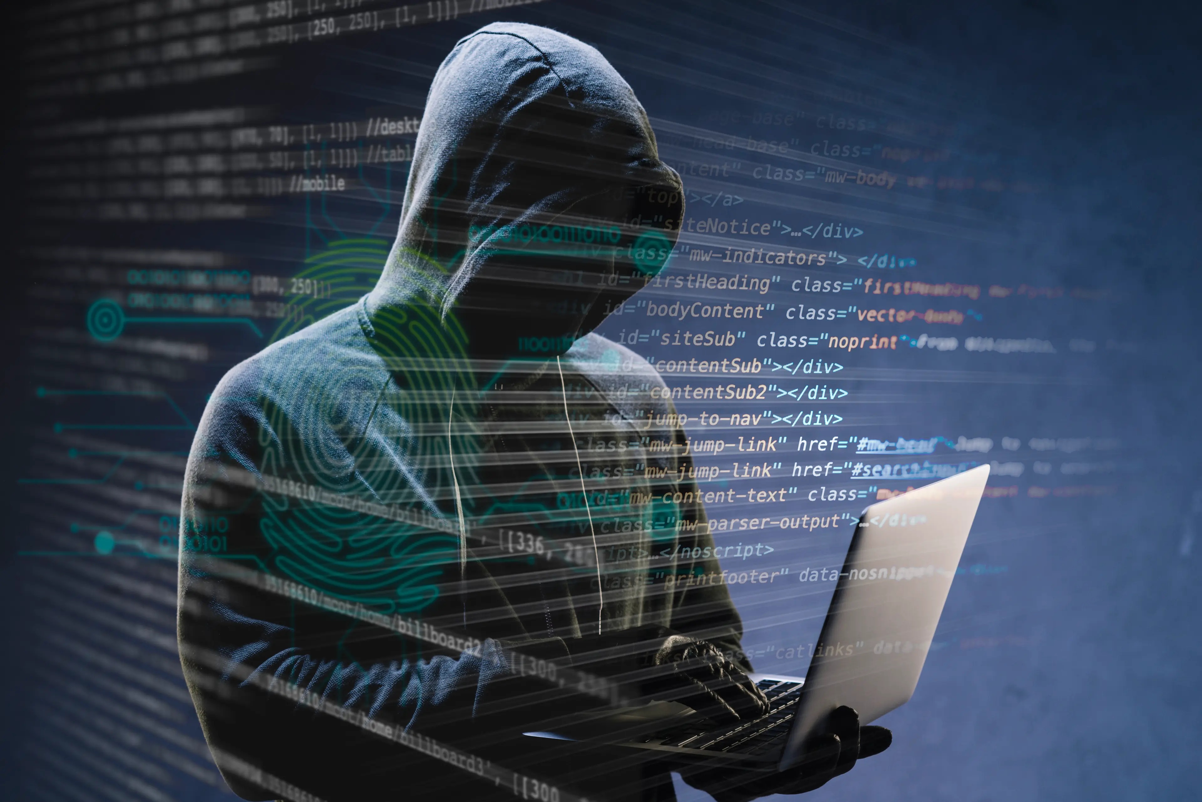a man in a hooded sweatshirt using a laptop