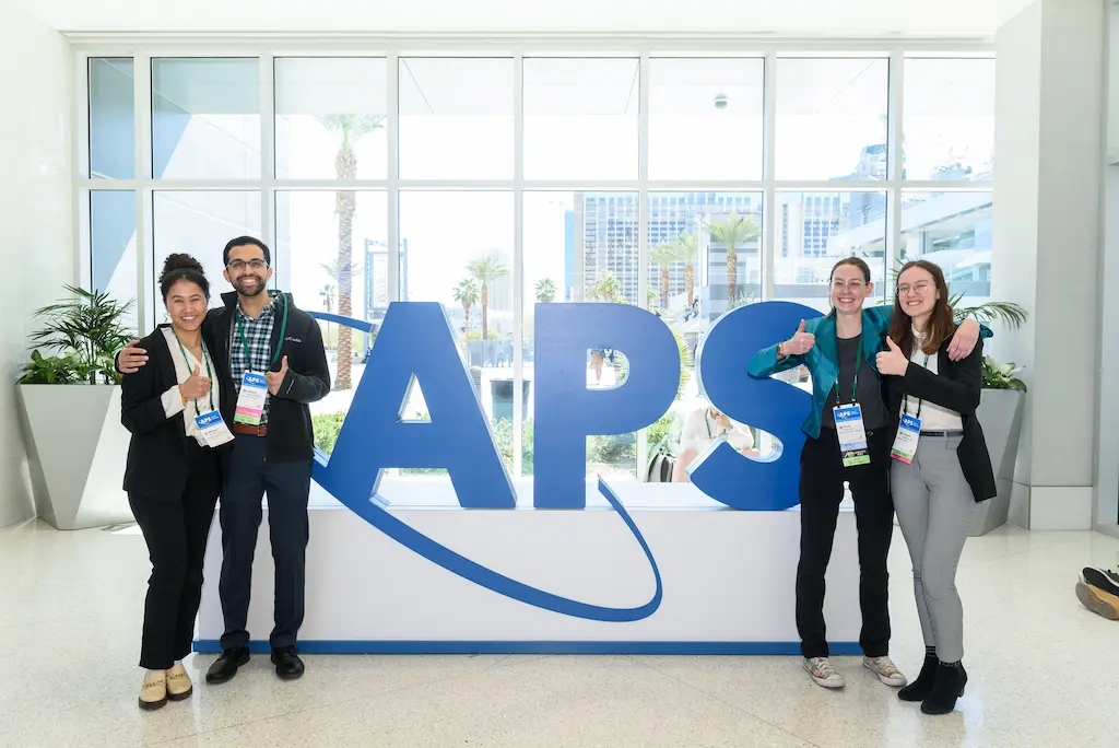 March Meeting attendees pose with the new APS logo