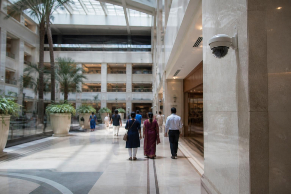 Security camera overlooking a hotel and mall atrium.