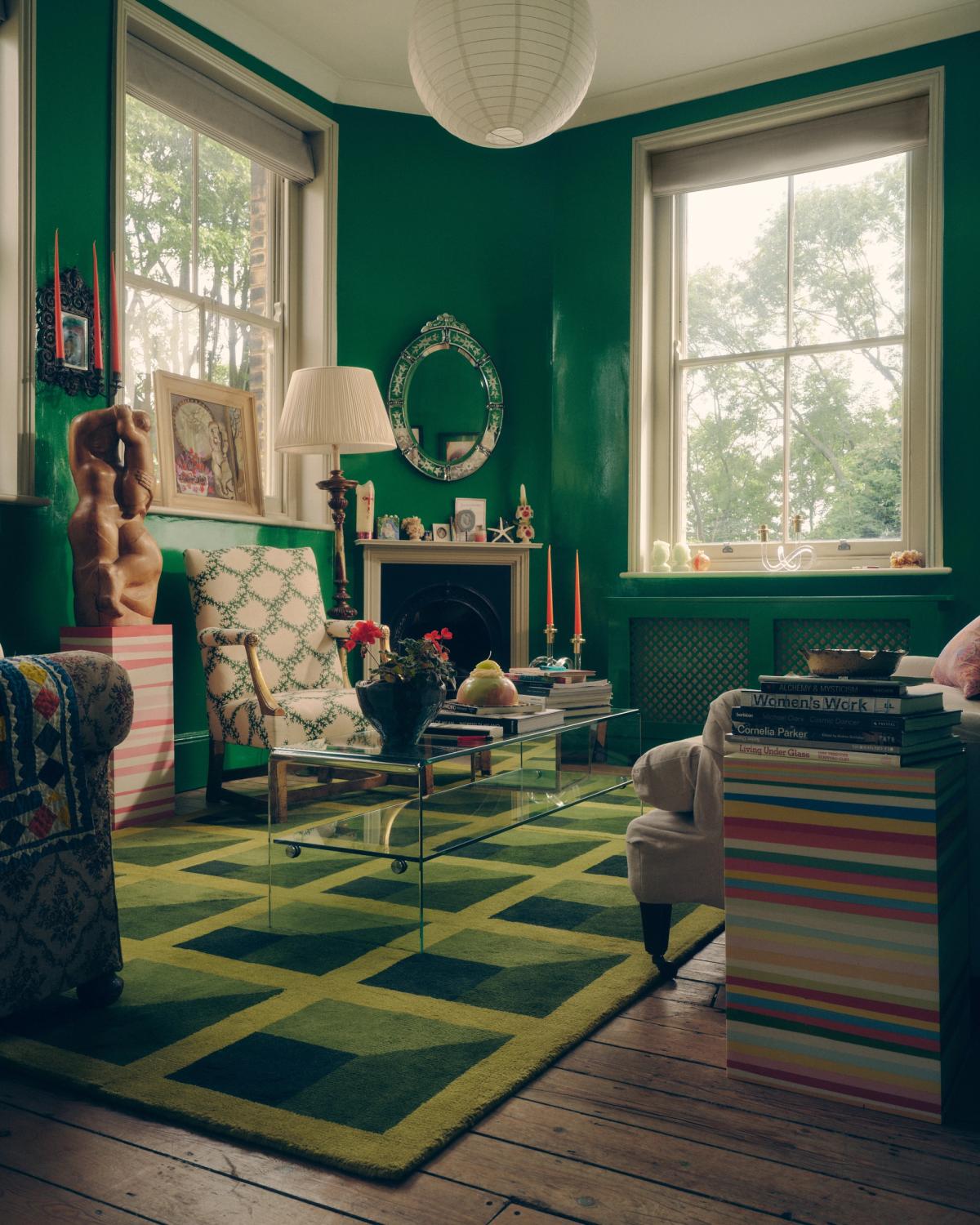 Plush wool rug Garden Maze in Green pictured in a maximalist living room with green walls and quirky interior design details.