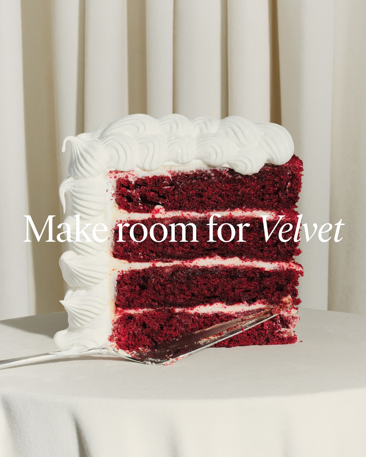 Close-up of a slice of red velvet cake on a plate, with the text “Make room for Velvet” overlaid.