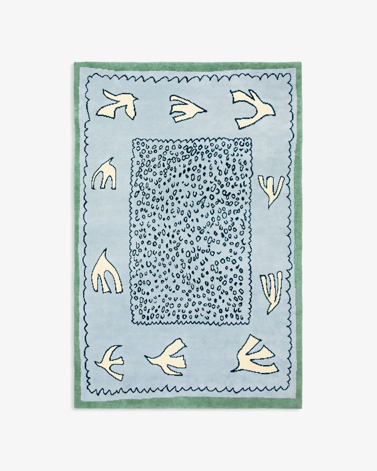 Product image of Columba in Blue. A soft wool rug in light blue with dove-like motifs and a green border, inspired by the calm of early summer skies.