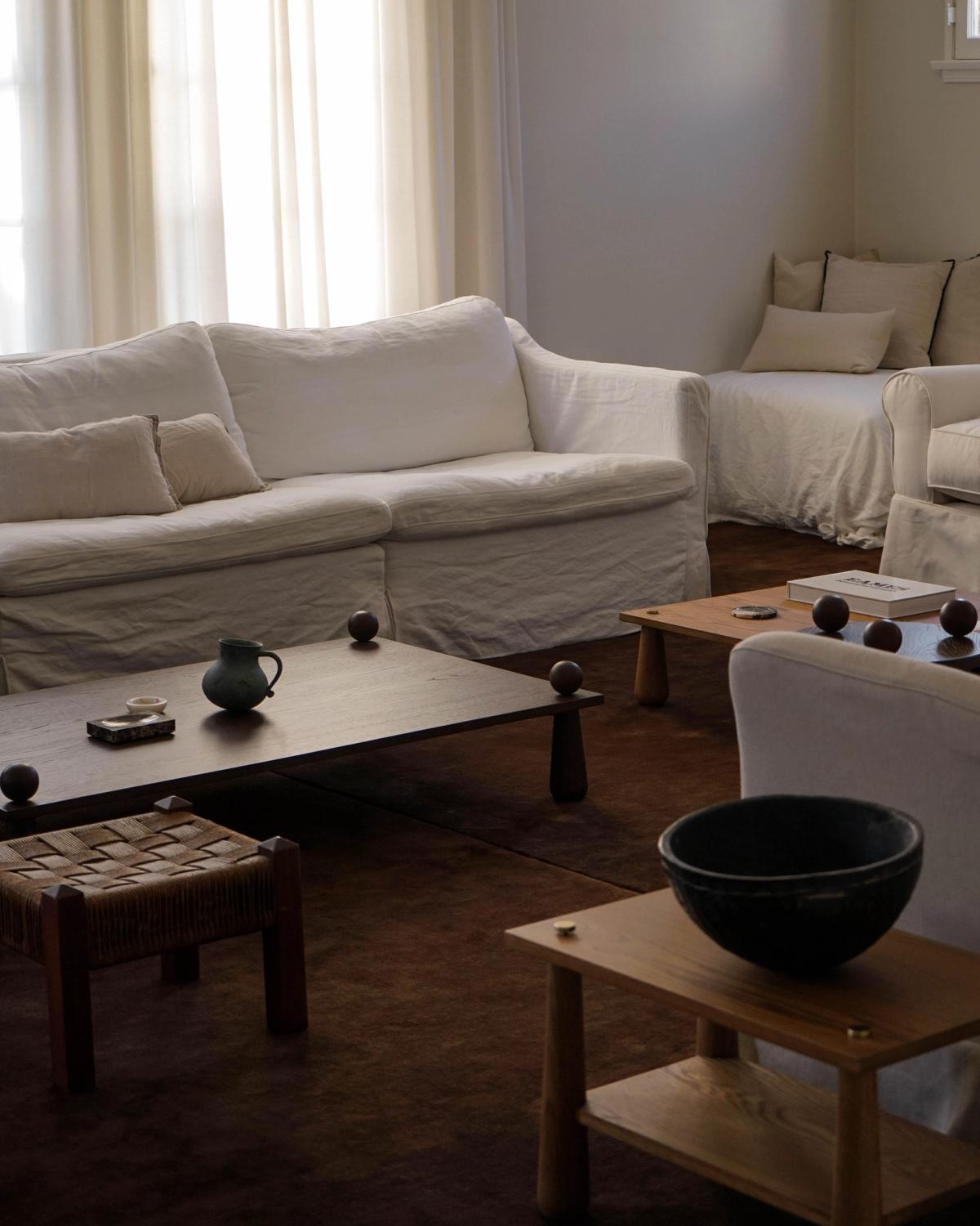 Photograph of Jessie Andrew's living room with neutral coloured furniture and the plush wool rug Grand - Walnut.