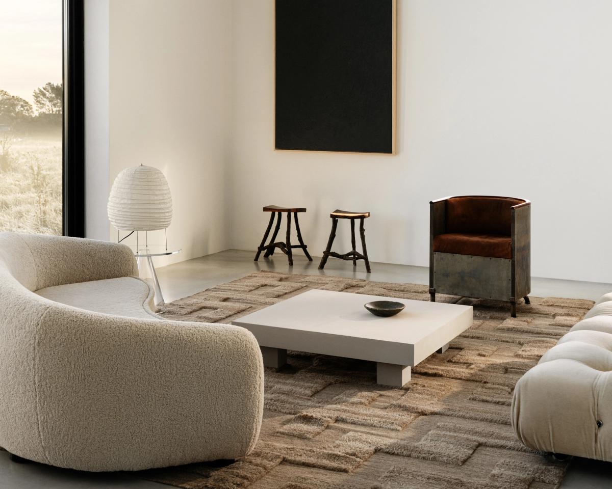 Shaggy wool rug Boho in Brown Mix pictured in a minimalistic living room with large windows and artistic interior design details in Sweden.