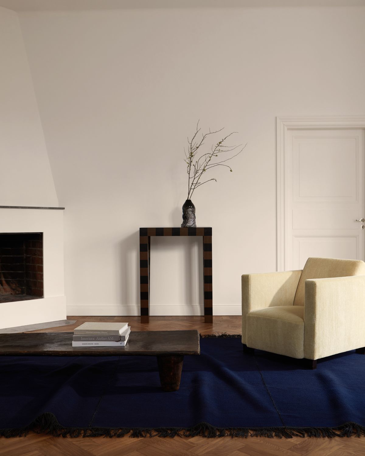 Stitches in the colour indigo displayed with vintage wooden table in a modern home