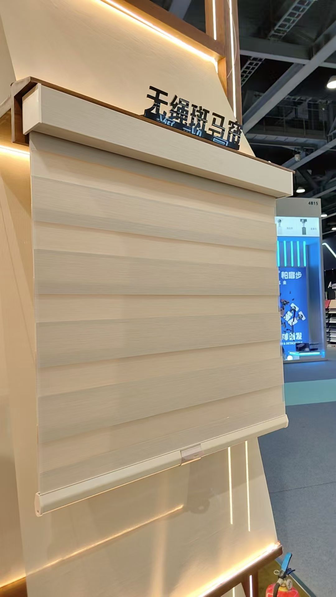 Large cordless Roman shade display with cream fabric, ALY HOME booth Guangzhou Design Week 2025
