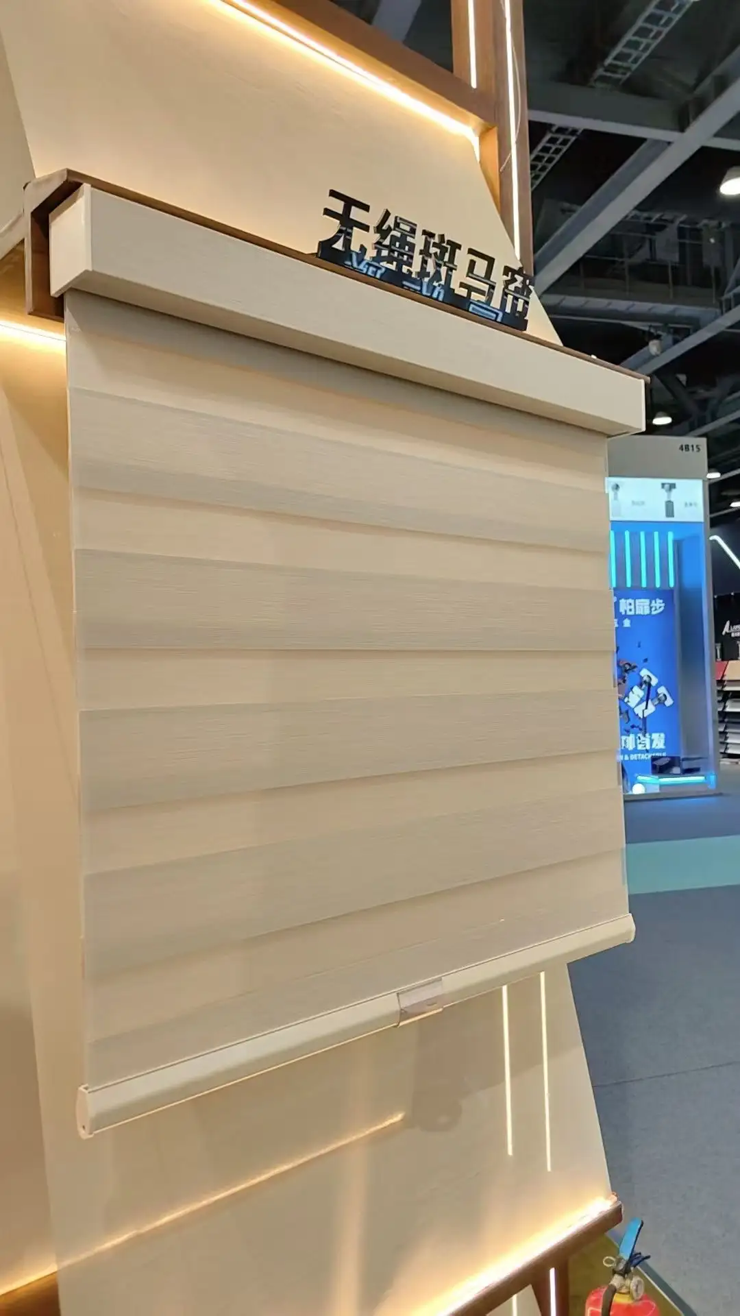 Large cordless Roman shade display with cream fabric, ALY HOME booth Guangzhou Design Week 2025