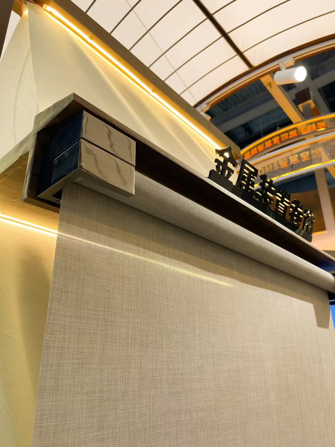 Close-up of metallic roller blind fabric weave and light-filtering pattern