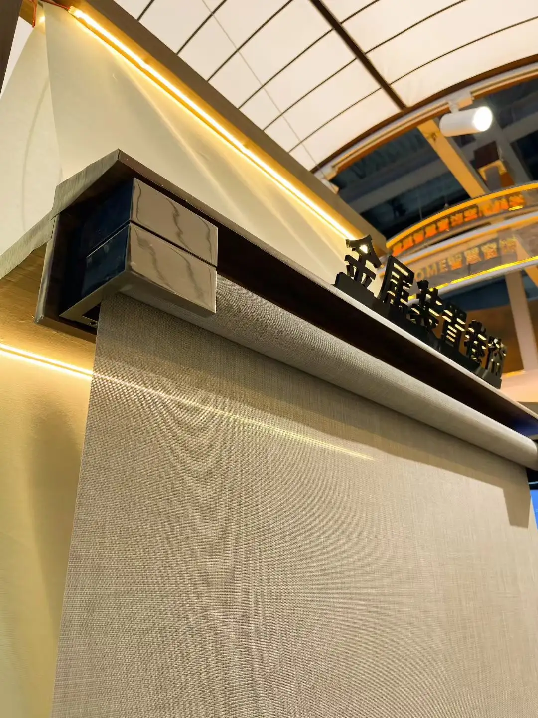 Close-up of metallic roller blind fabric weave and light-filtering pattern