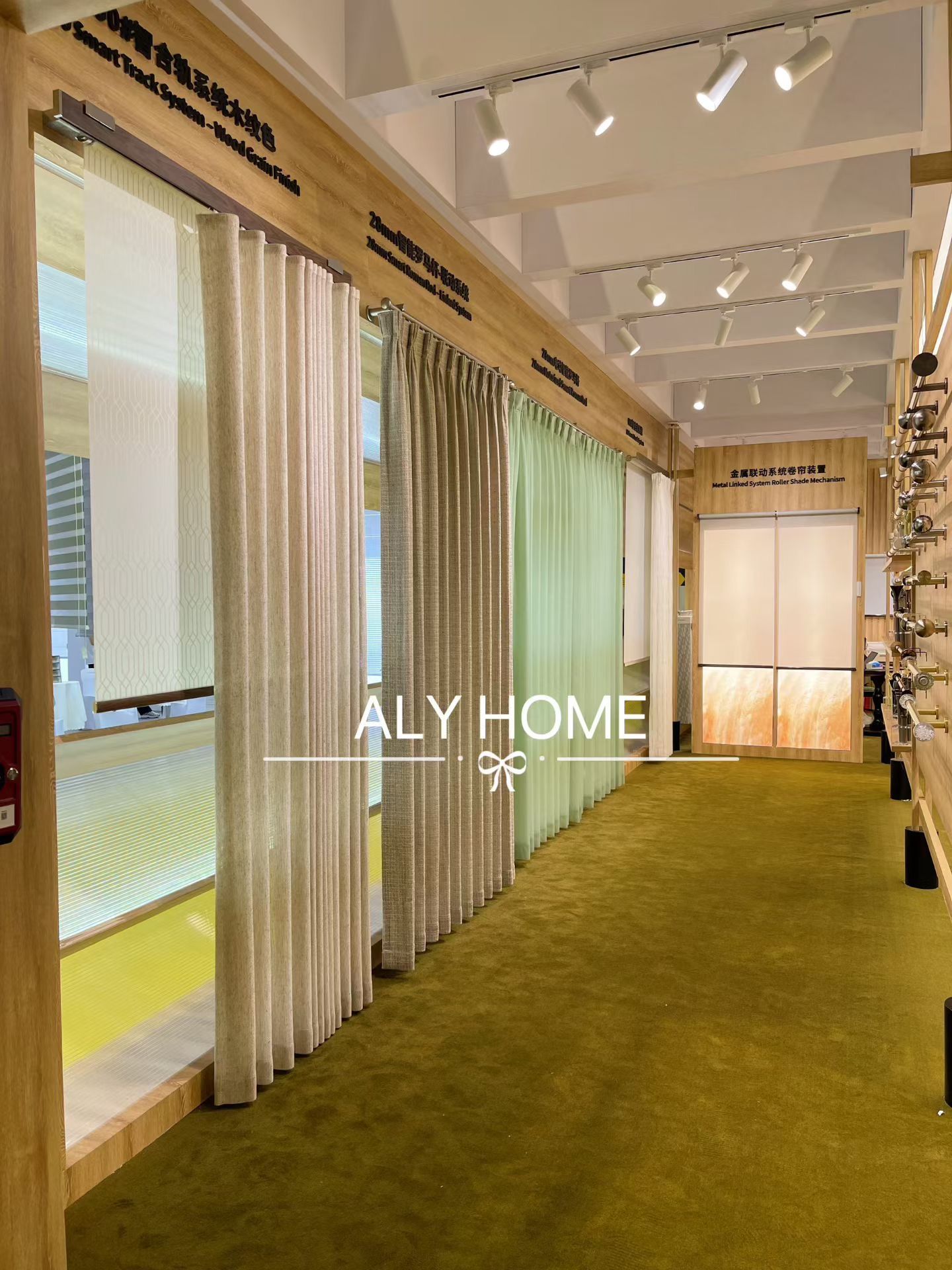 Curtain rod systems aisle at ALY HOME R+T Asia 2025 booth showing Smart Track, Zebra Smart, and Metal Linked Roller Shade Mechanism