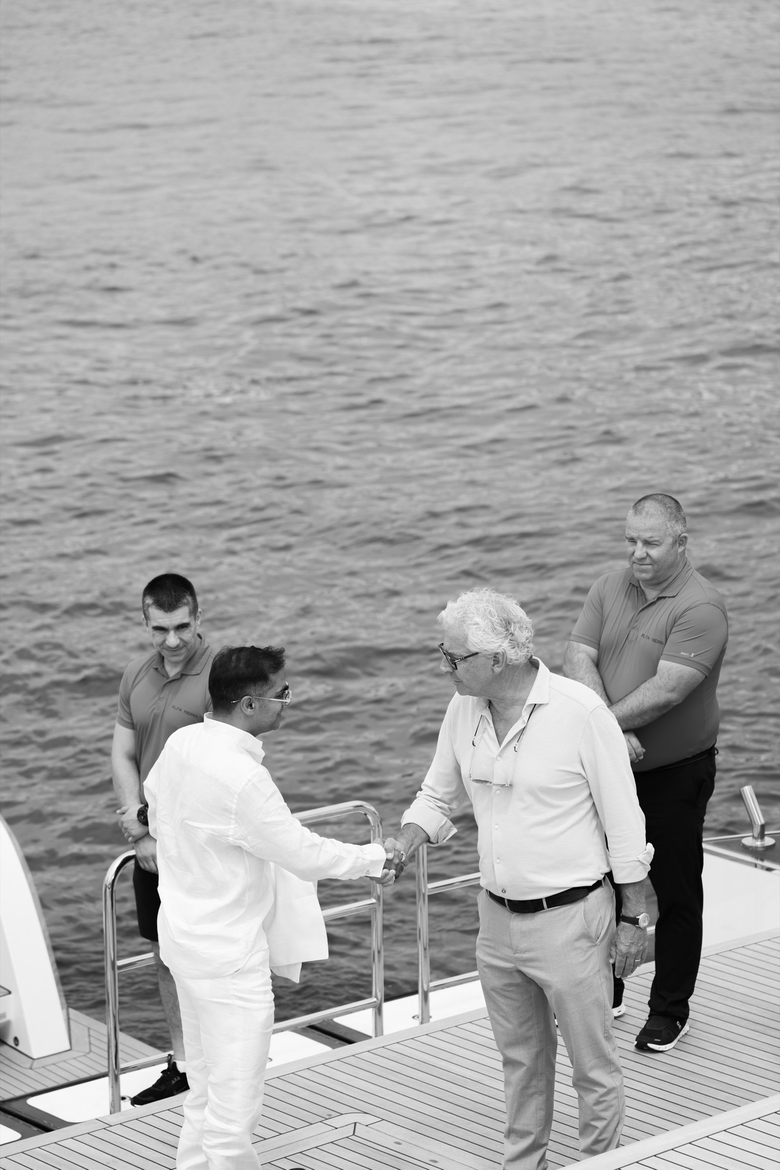 A guest welcomed aboard ALFA NERO by the crew at Cannes