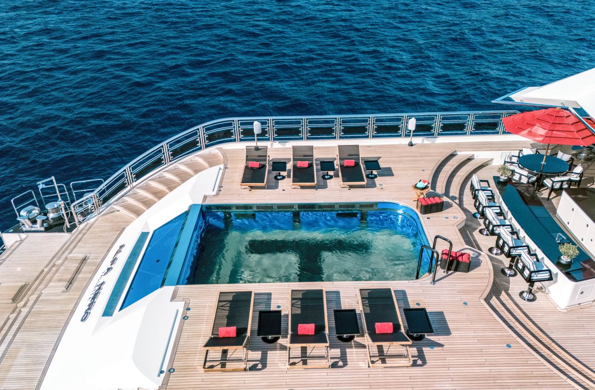 ALFA NERO aft deck pool flanked by sun loungers, 82m Oceanco motor yacht for sale