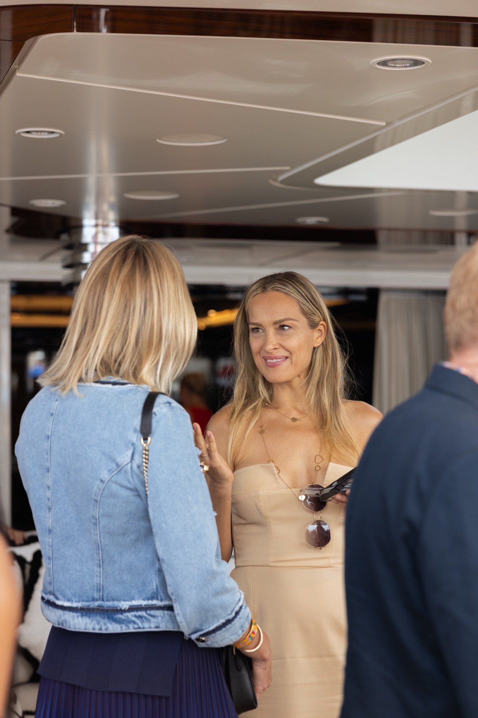 Guests in conversation aboard ALFA NERO at the Ocean Bottle evening