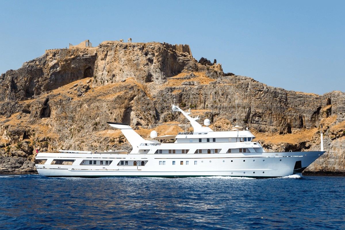 ESMERALDA at anchor beneath a rocky headland, 62m Codecasa motor yacht for sale