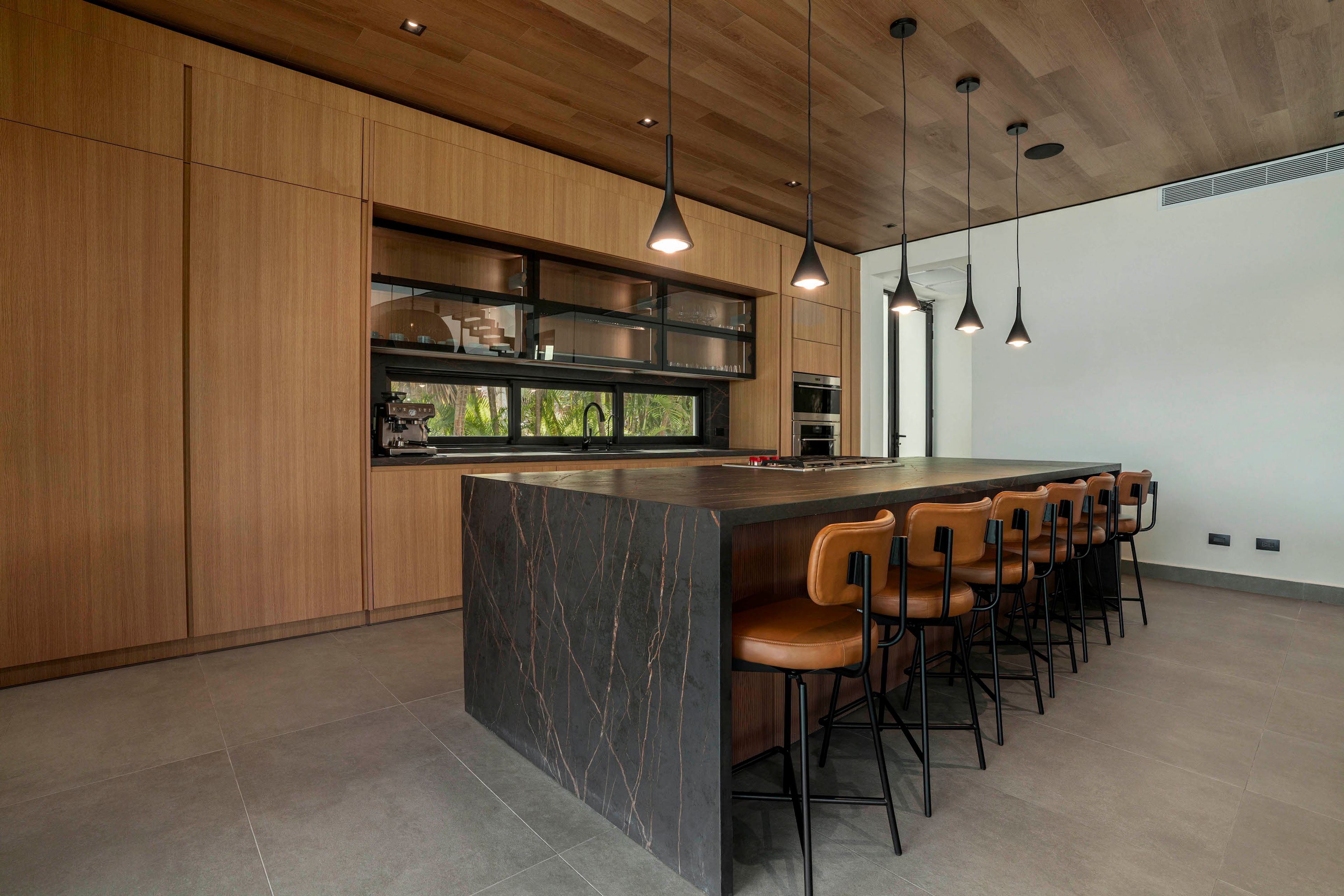 Modern chef kitchen and living area at Villa Roge