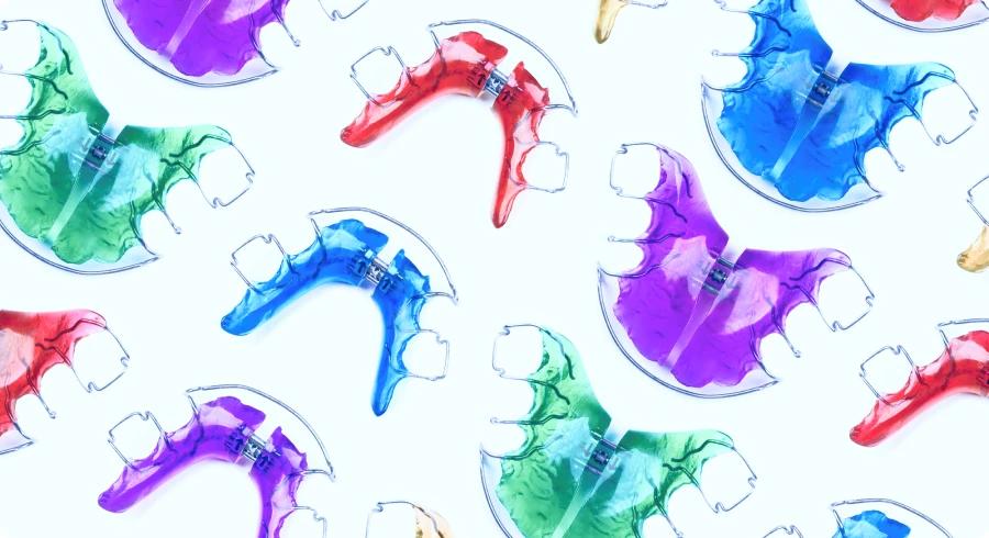 group of colorful custom retainers on white background