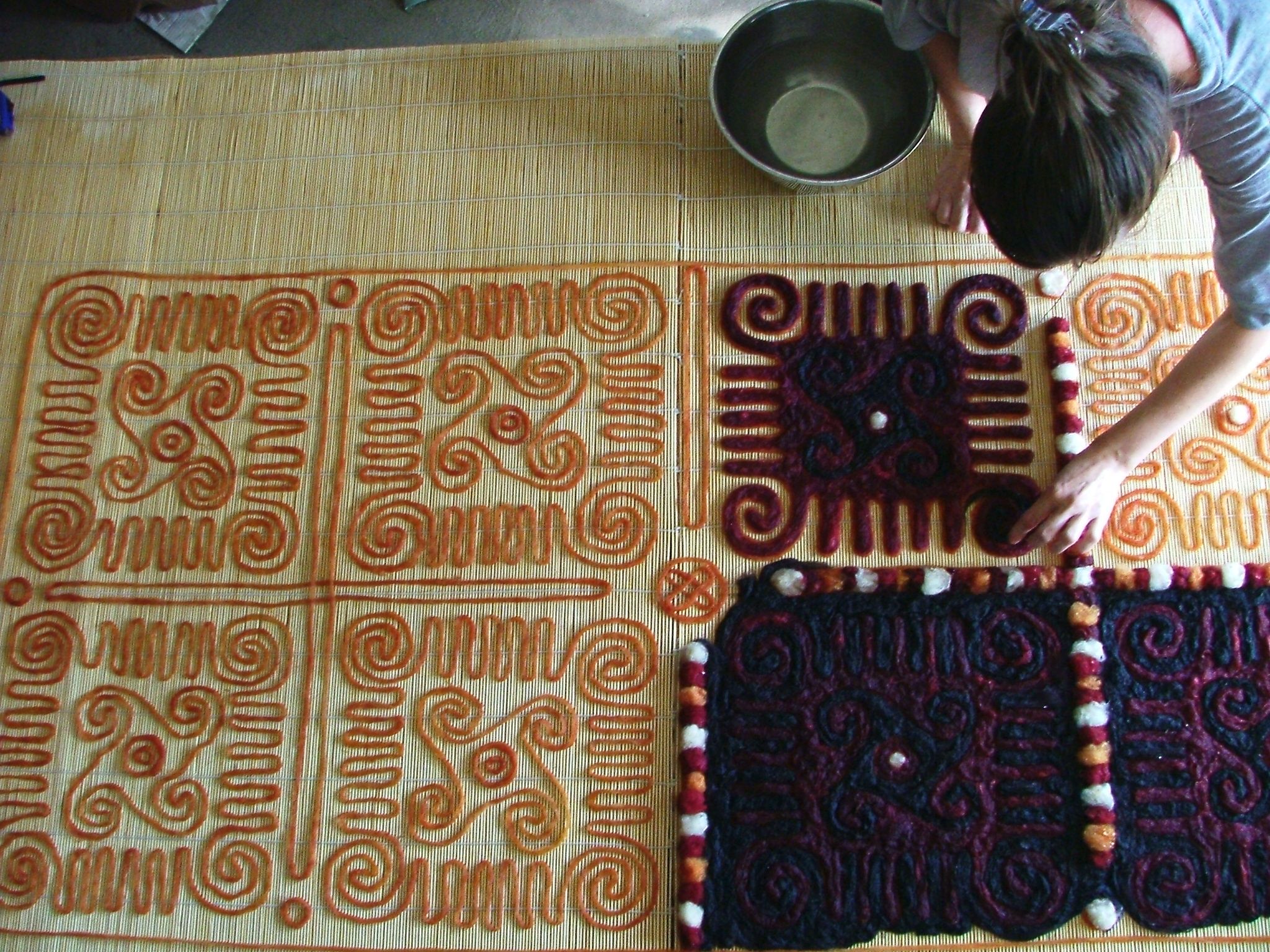 a woman making felt