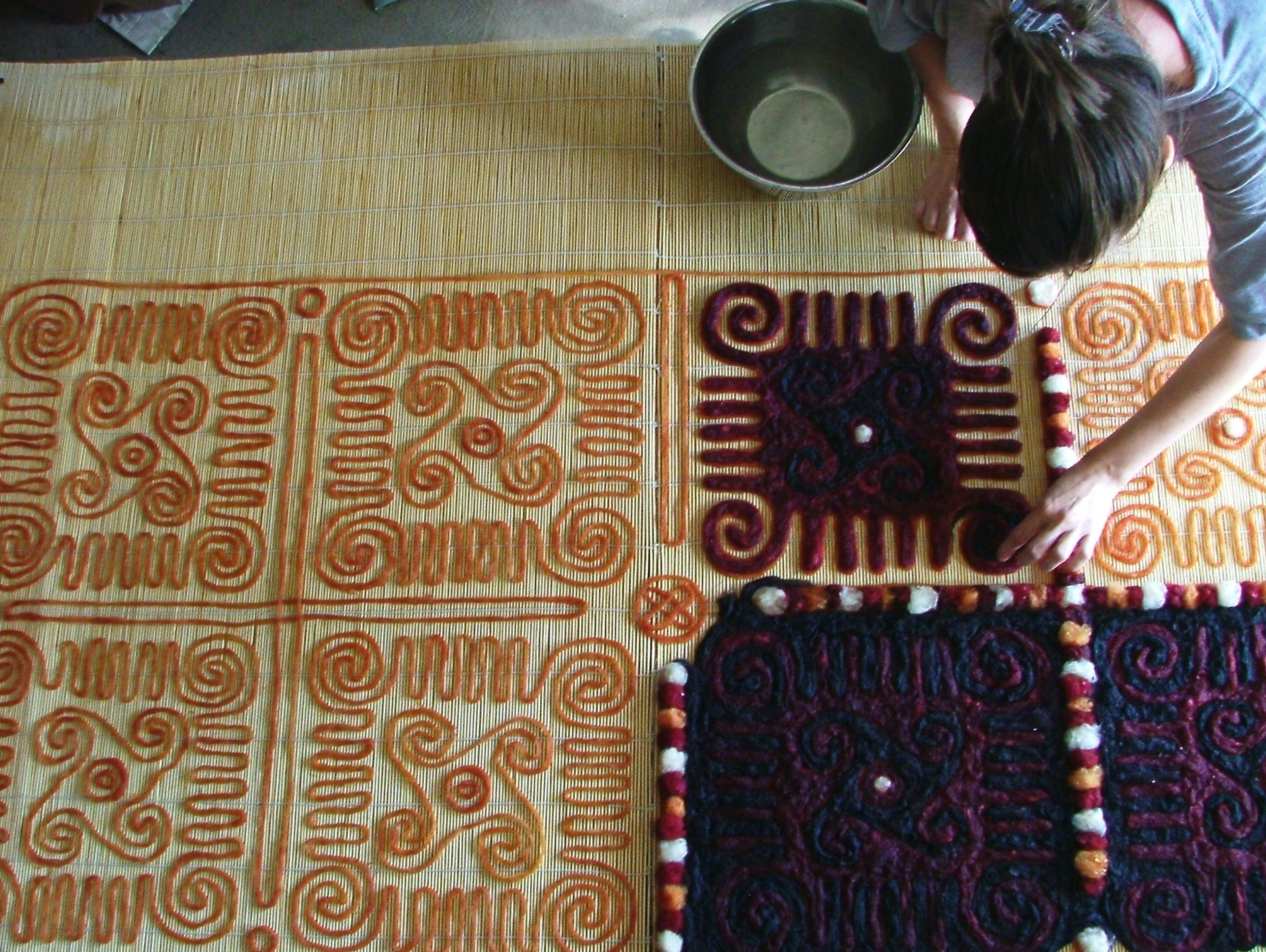 a woman making felt