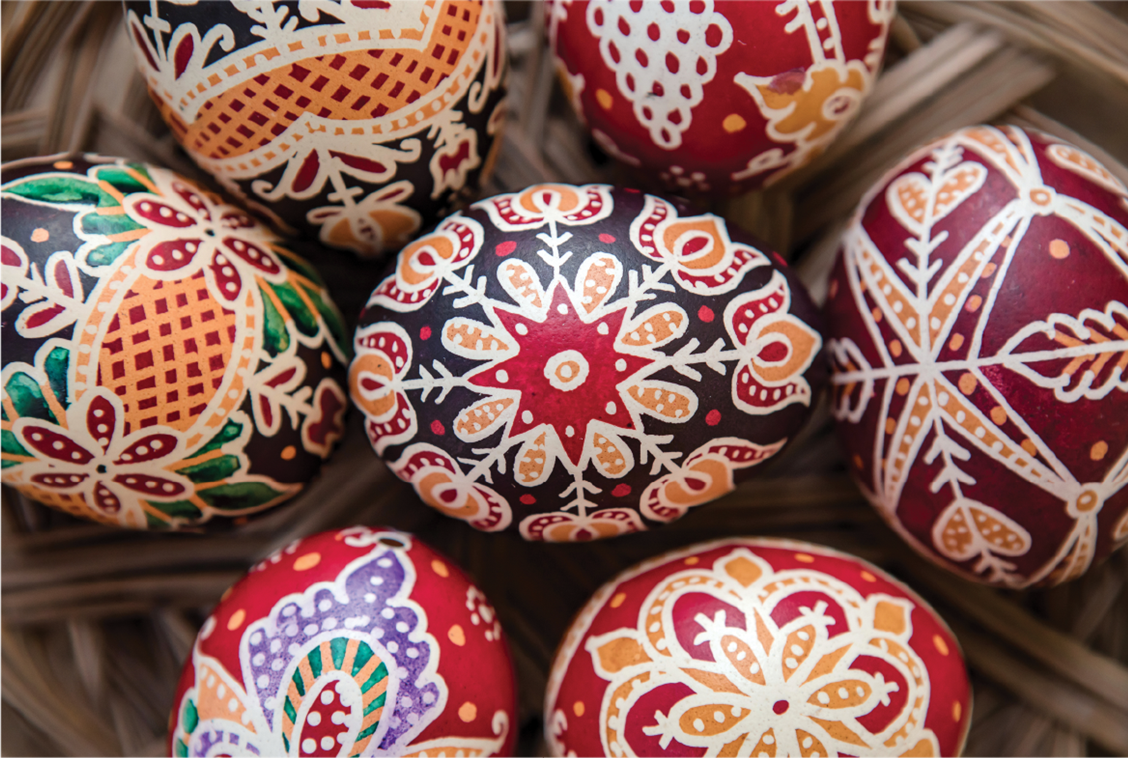 a basket of decorated eggs