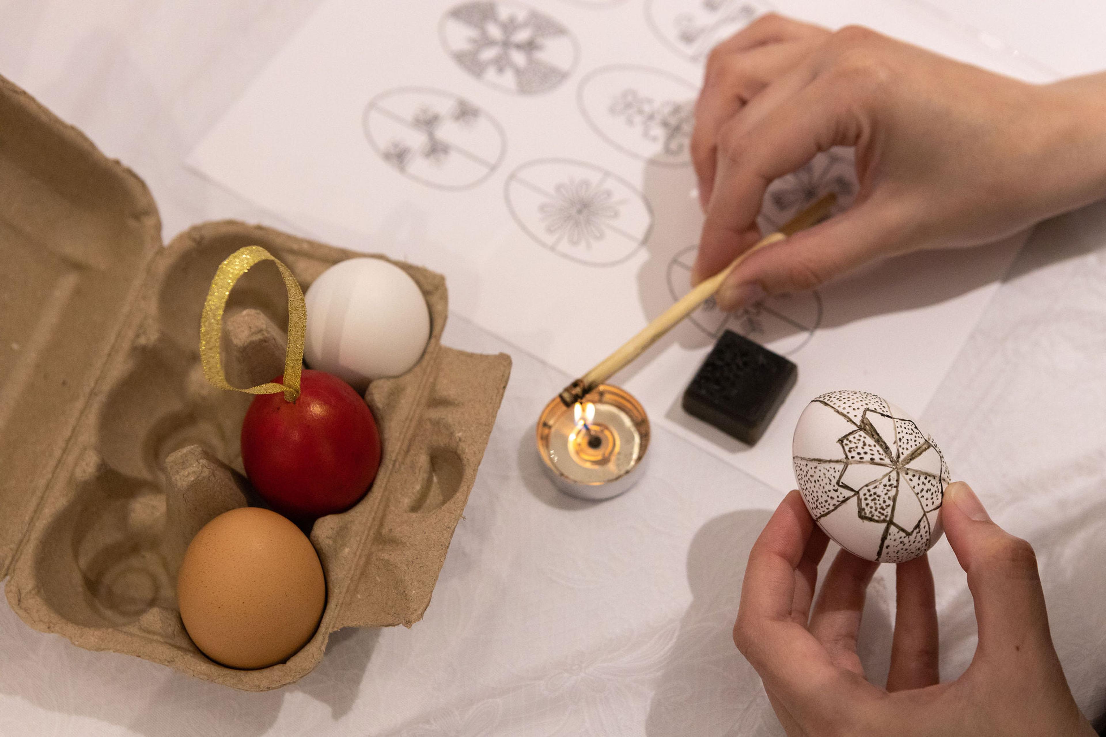 using wax to decorate an egg