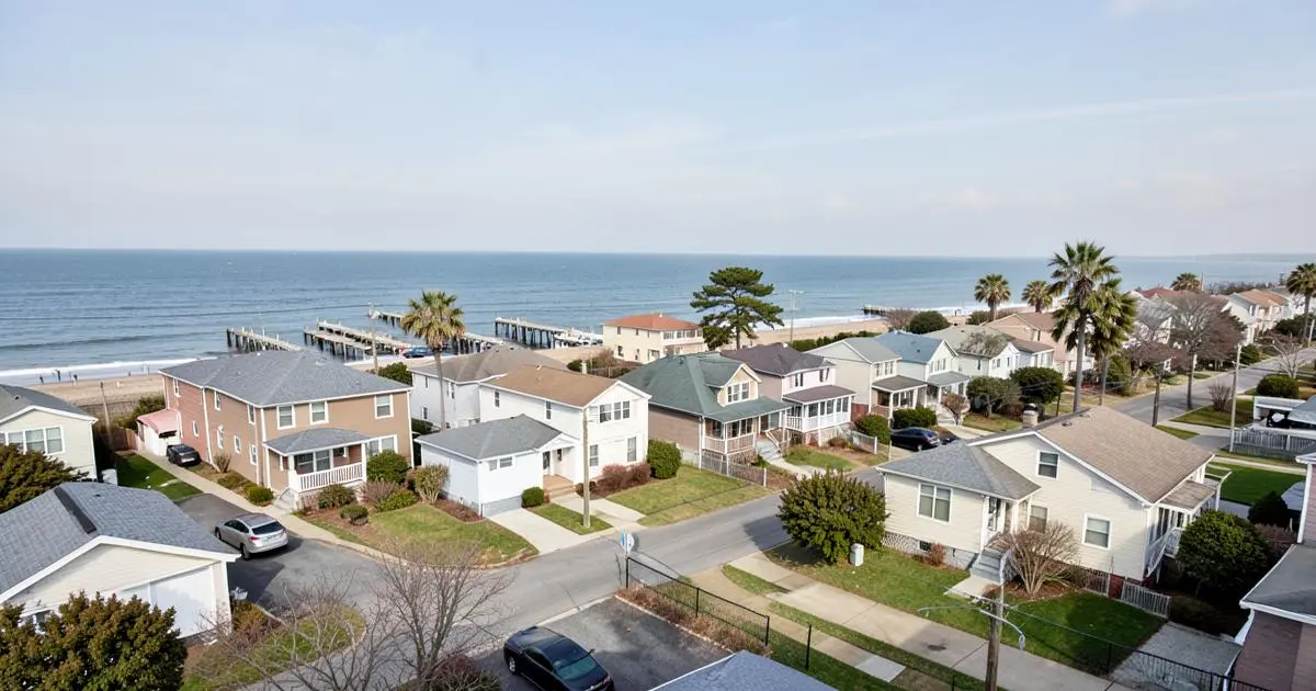 Single-family homes and bungalows on a residential block near the beach in Far Rockaway, Queens, NY