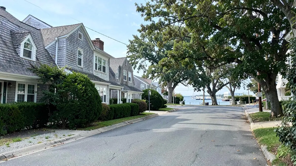 Colonial homes on a sloping street above Manhasset Bay in Port Washington, NY, Nassau County
