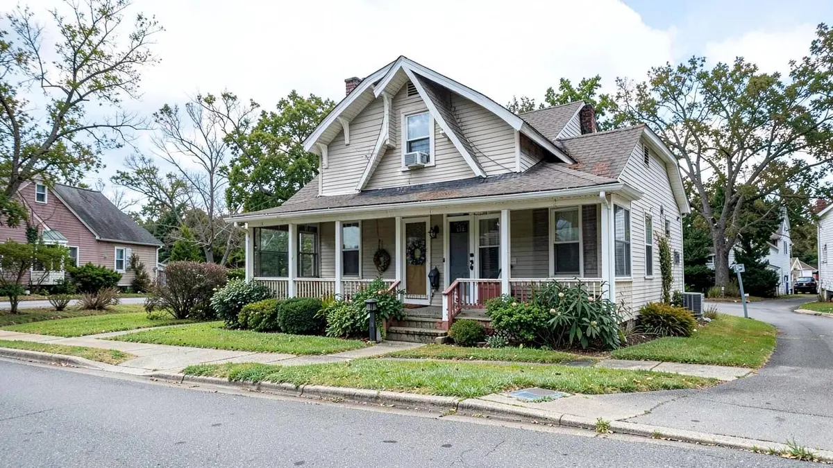 Postwar cape style home on a residential street in Deer Park, NY in the Town of Babylon
