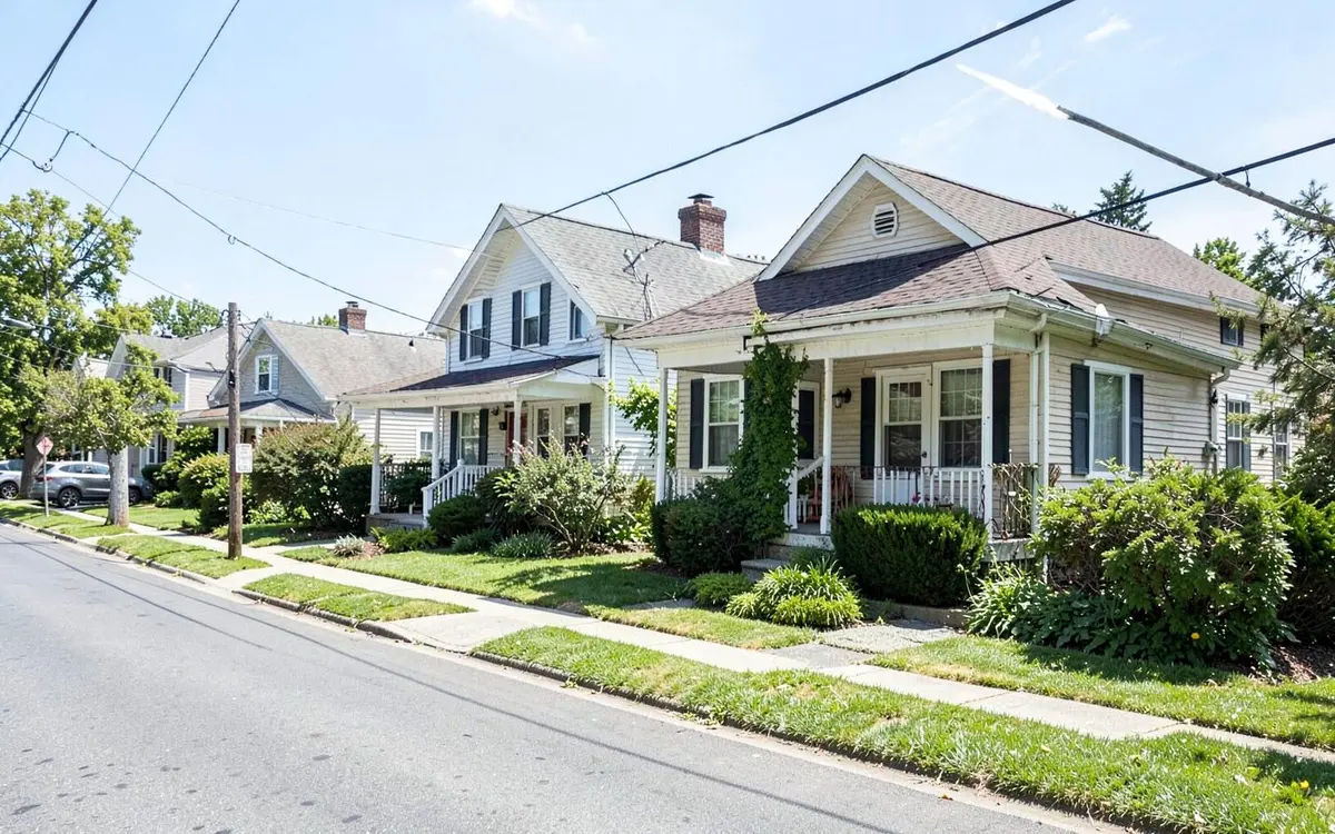 Postwar cape and ranch homes on a suburban street in East Meadow, NY, Nassau County