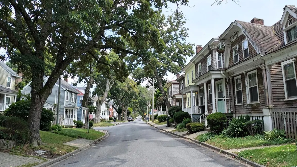 Homes on a hillside street above the harbor in Glen Cove, NY, Nassau County