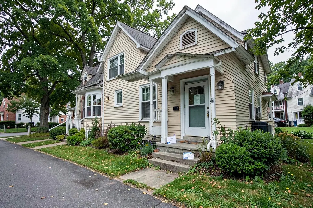 Long Island home in Brentwood, NY with a certified mail foreclosure notice on the front step