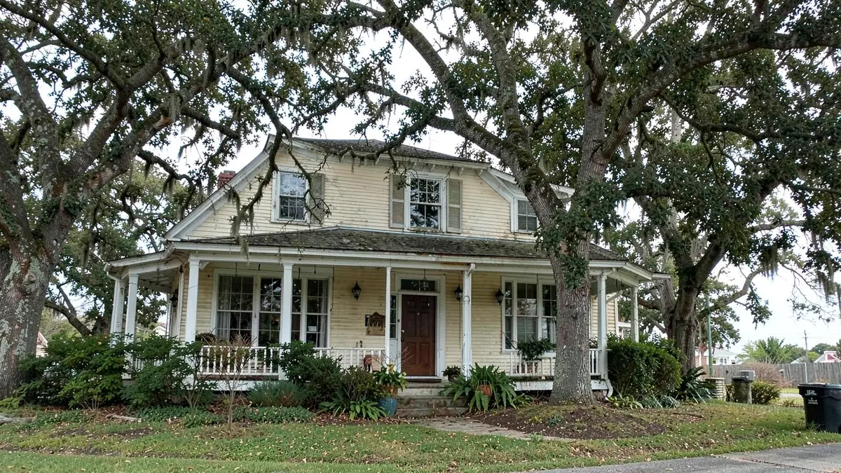 Older colonial home with mature trees in Islip, NY on the South Shore of Suffolk County
