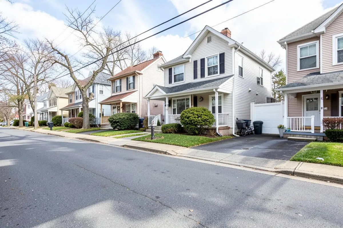 Detached and semi-attached homes with driveways on a residential street in New Dorp, Staten Island, NY