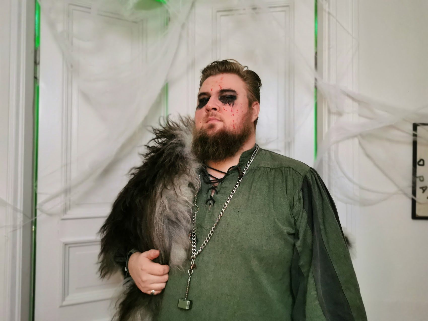 a man with a beard is dressed in a viking costume for halloween .