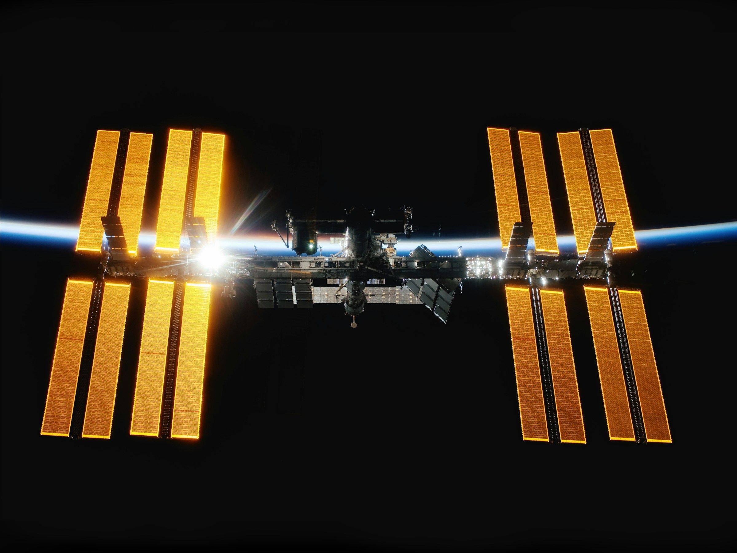 The International Space Station above the blue edge of Earth