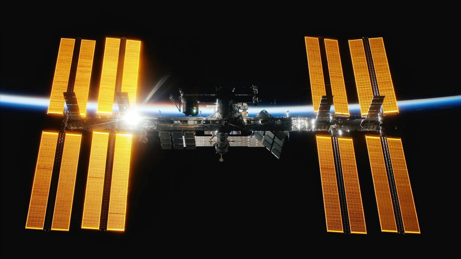 The International Space Station above the blue edge of Earth