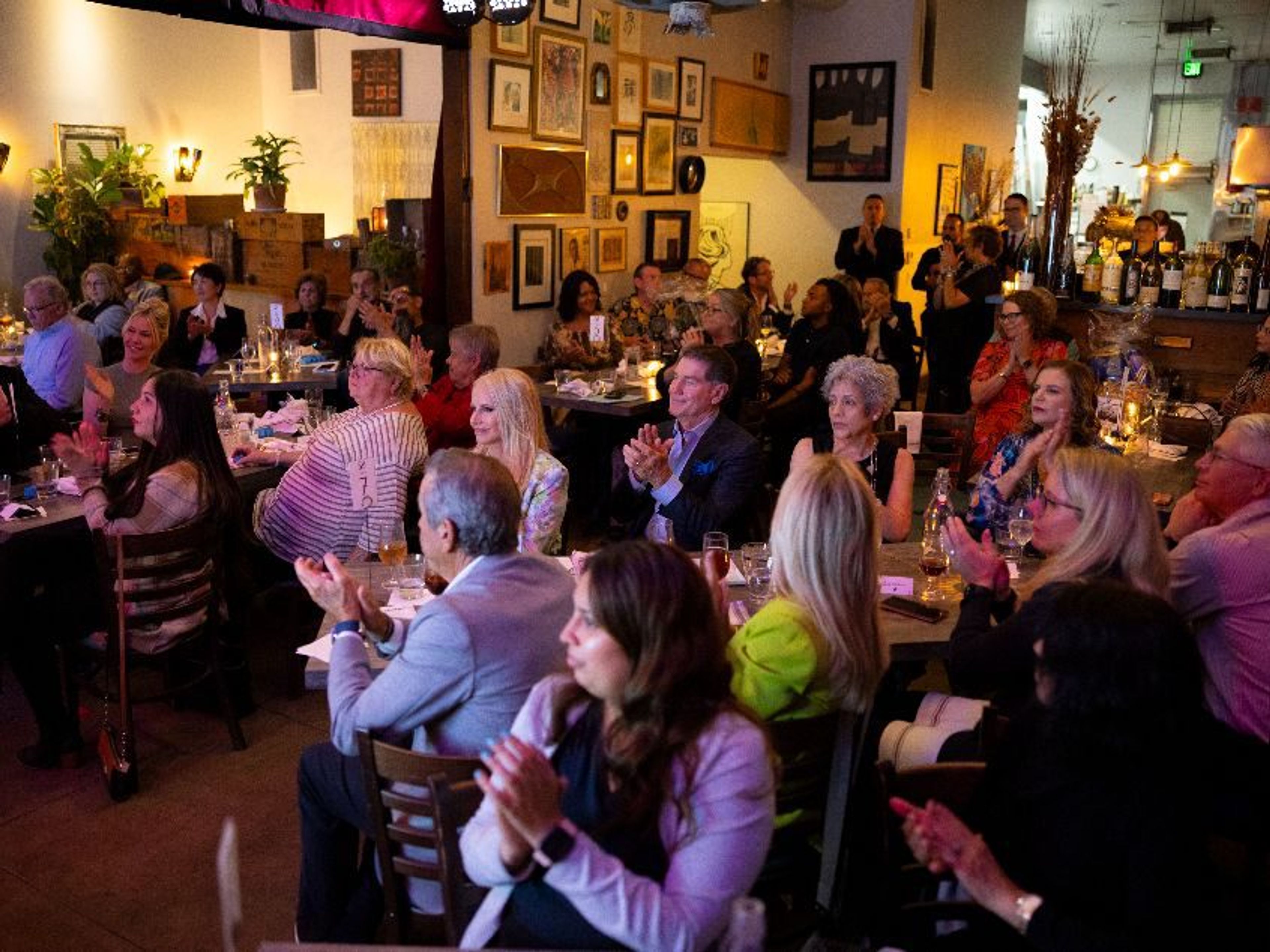 A sold out crowd at Bacchus Kitchen in Pasadena helped support families at Impact.