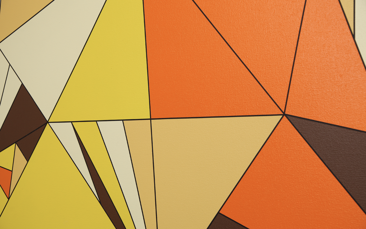 Detail of painting with yellow, white and orange triangles in acrylic paint