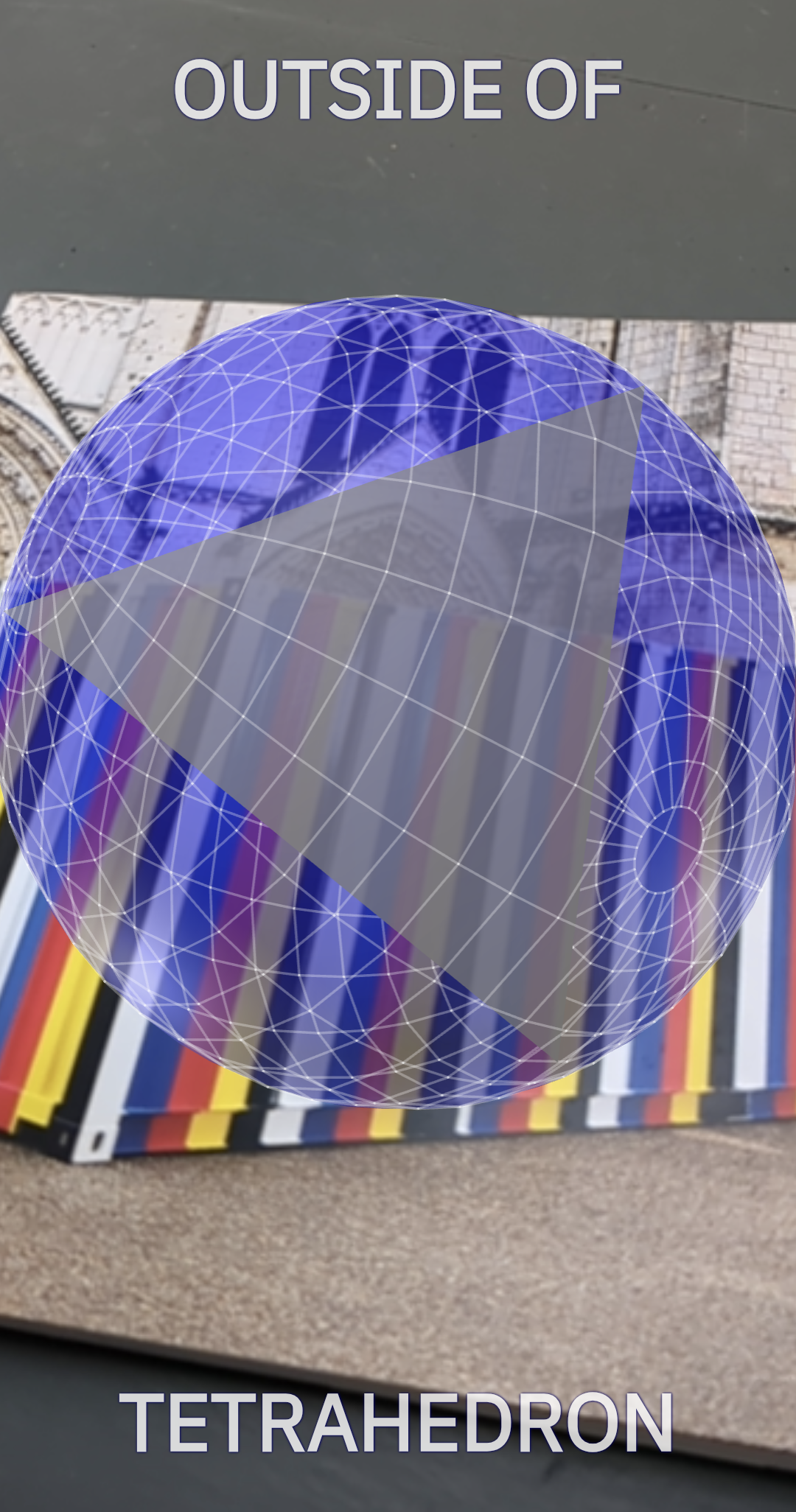 Outside Of and Tetrahedron text with wireframe sphere containing a tetrahedron